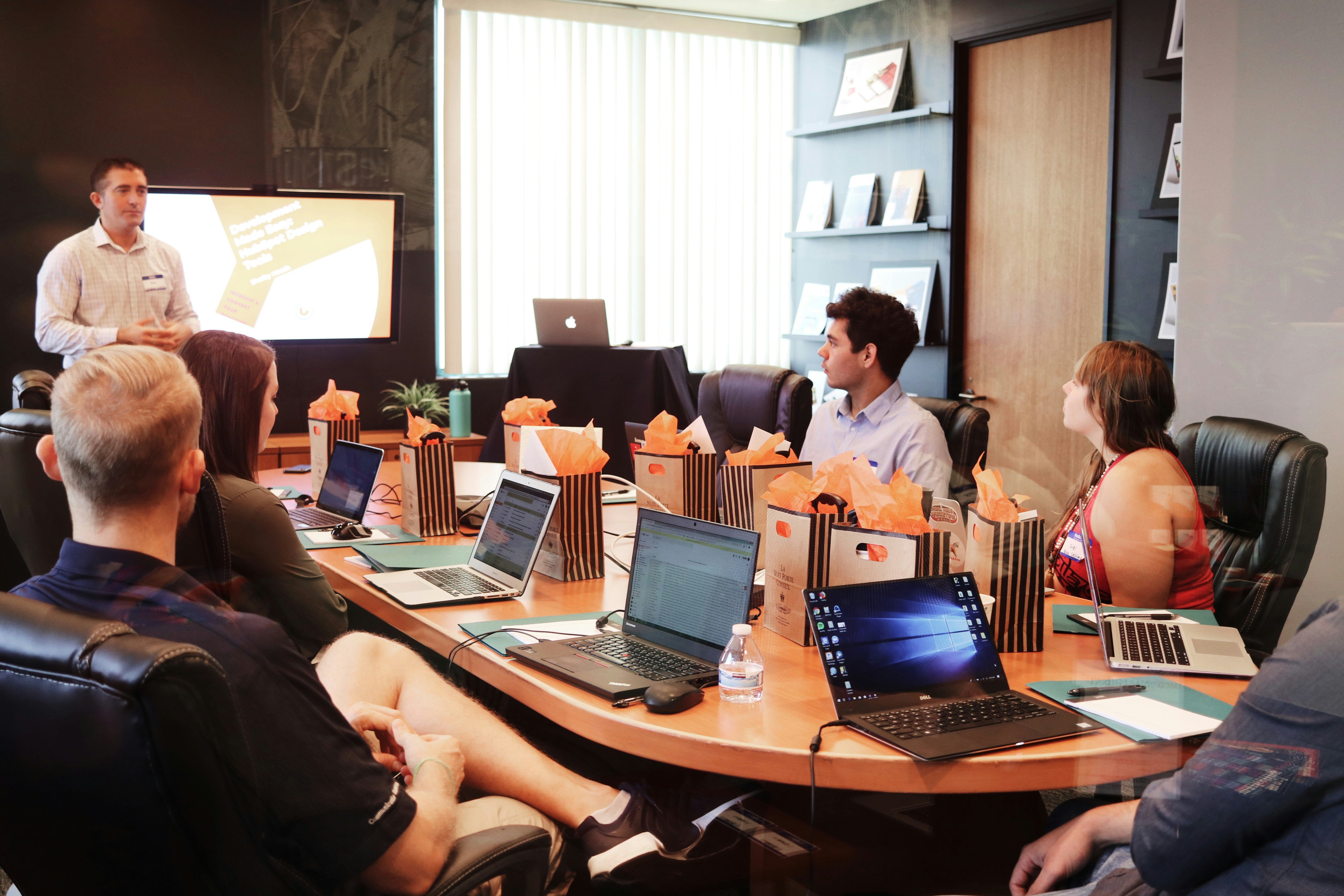 Business acquisition team reviewing an opportunity